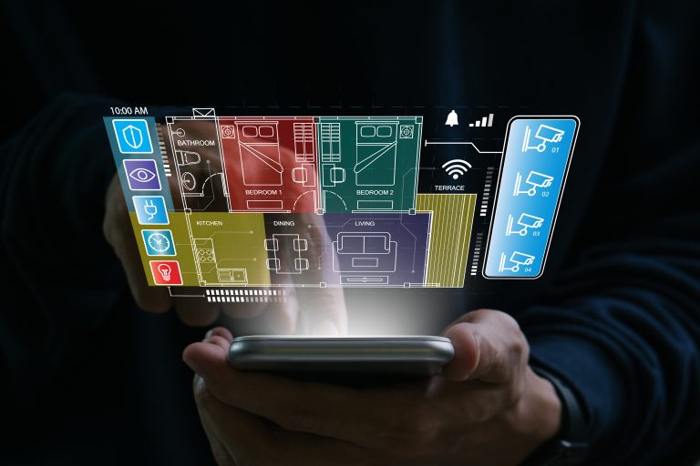 Smart home concept.Hand of man using smart home control app on mobile phone.Remote home control.Smart home technology.